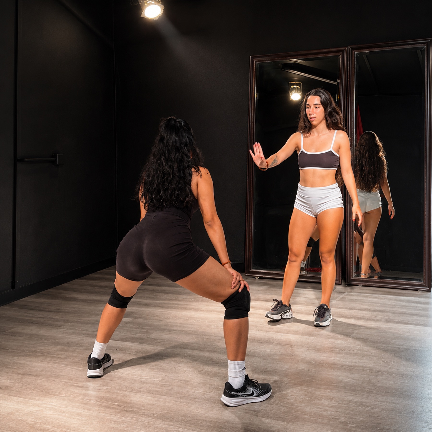 Nika Chill correcting a student during a private session